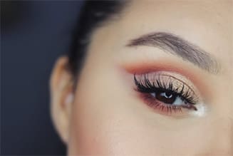 a person’s eye with make up