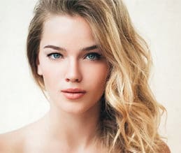 a blonde woman with blue eyes and fair skin