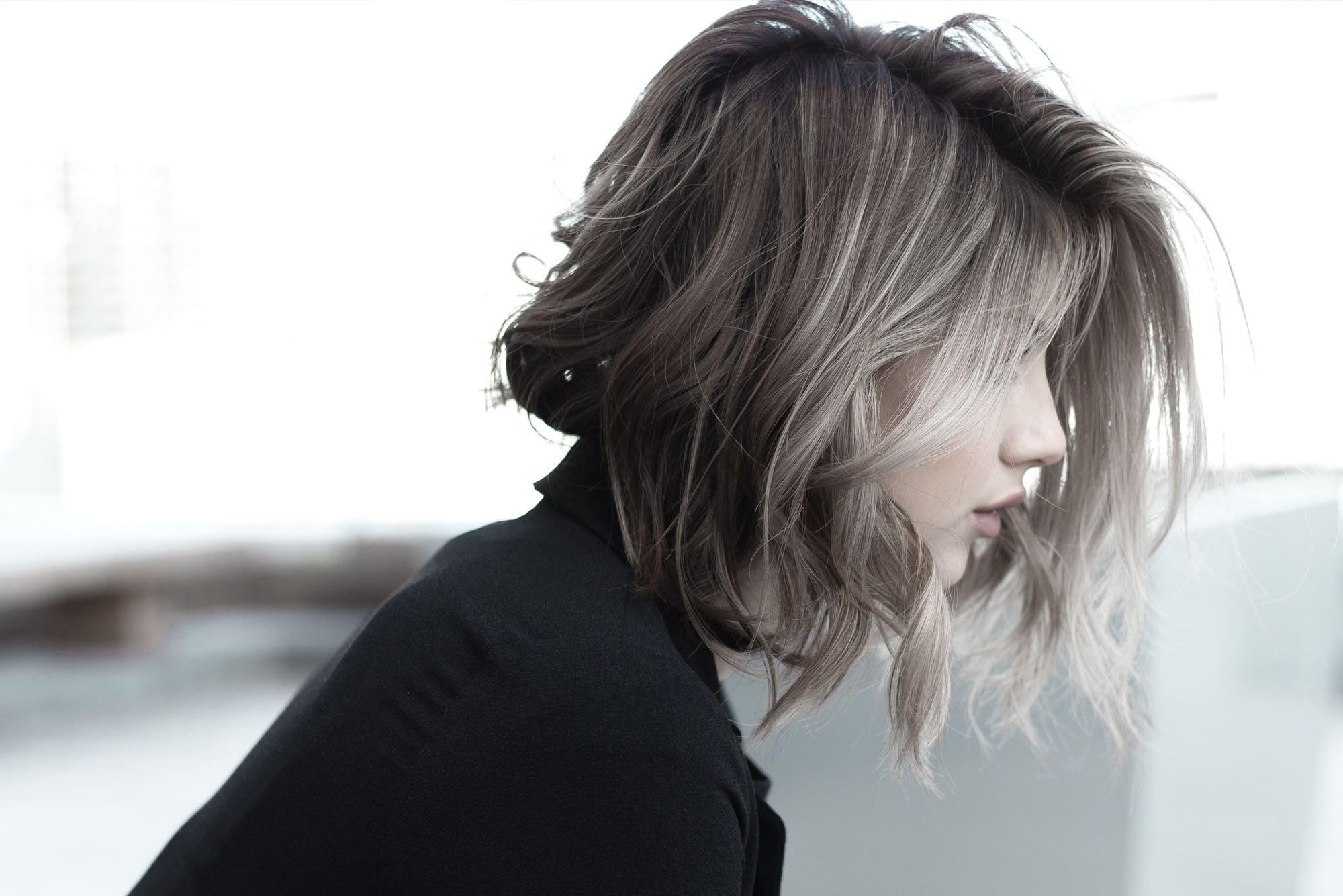 Short textured ash-blonde bob, profile view