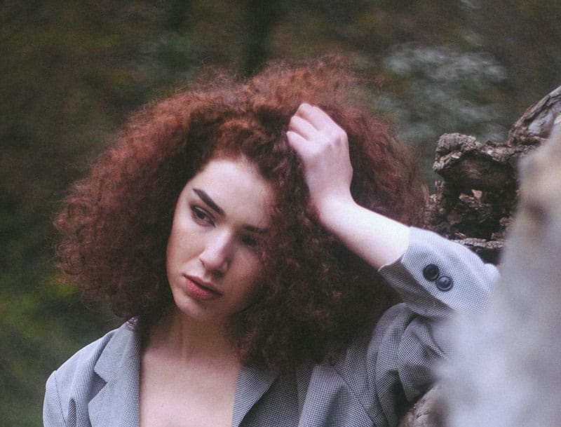 woman with curly red hair