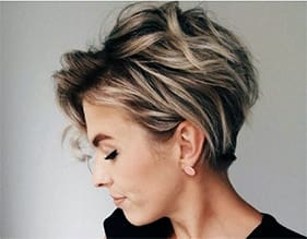 a woman with short hair and blonde highlights